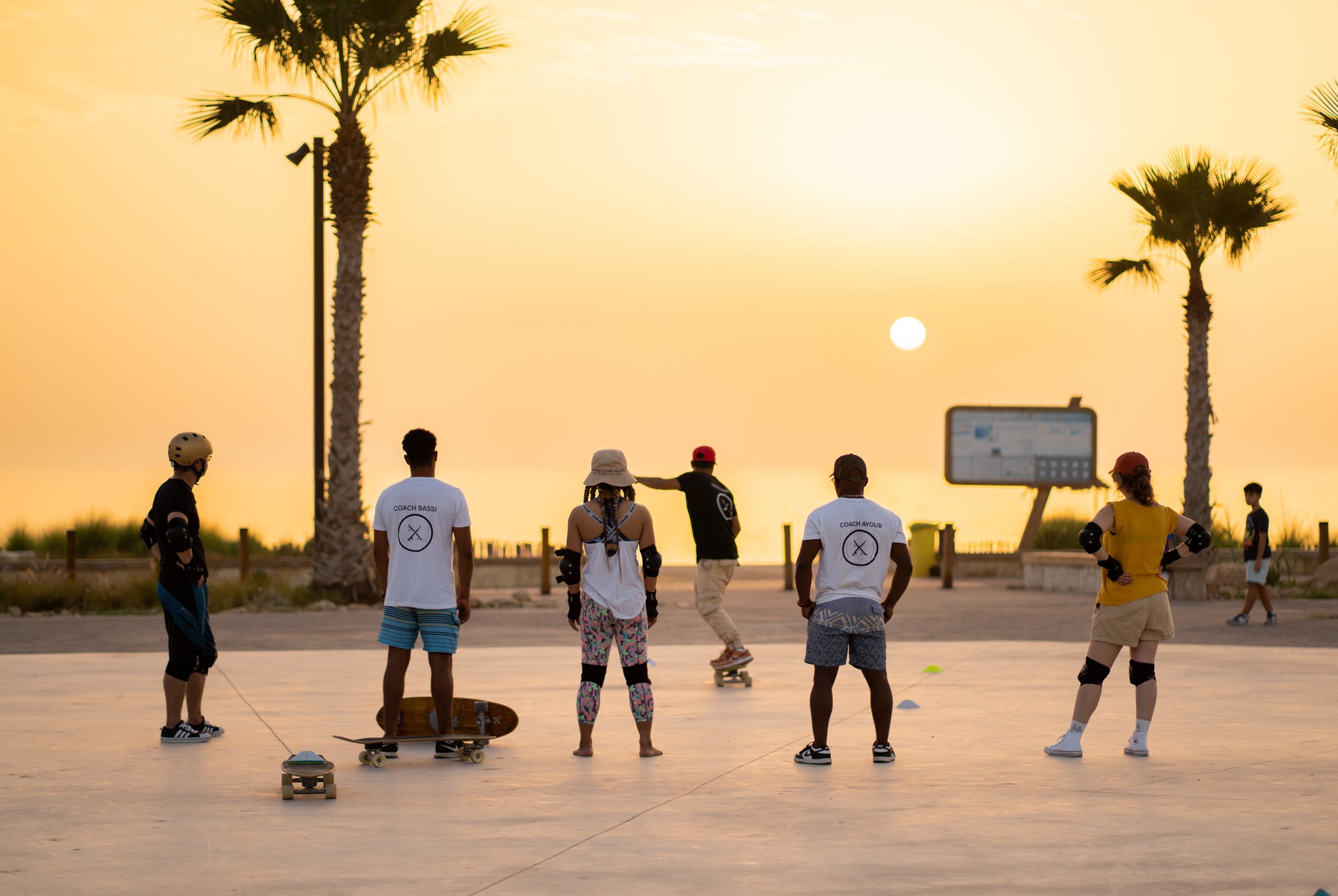 Sunset surf-skate coaching session with certified local coaches