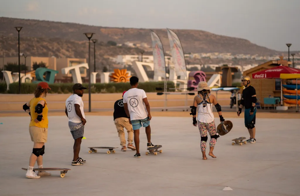 Coached surf-skate session on the coastal skate plaza at sunset